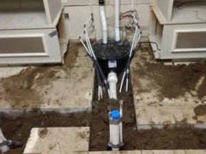 plumbing run underground at salon in michigan
